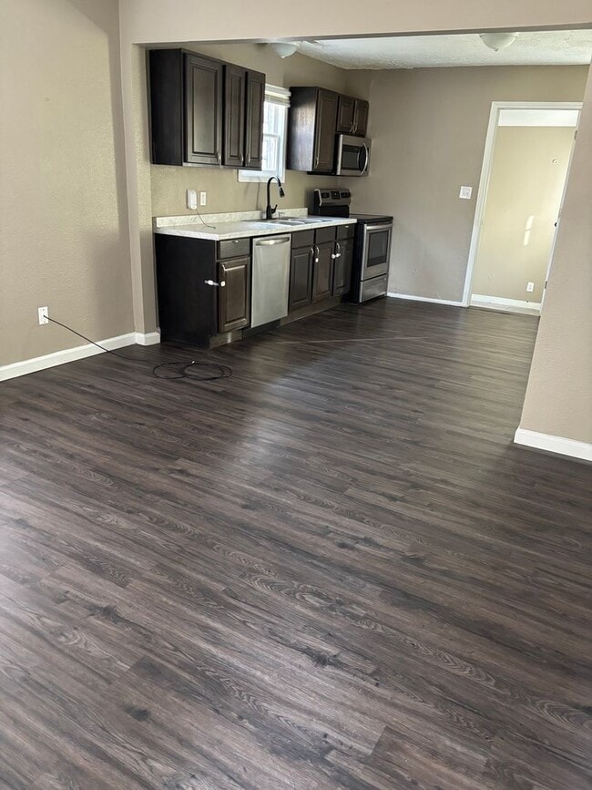 Photo - “Move-In Ready 2-Bedroom with Expansive Privacy Yard”