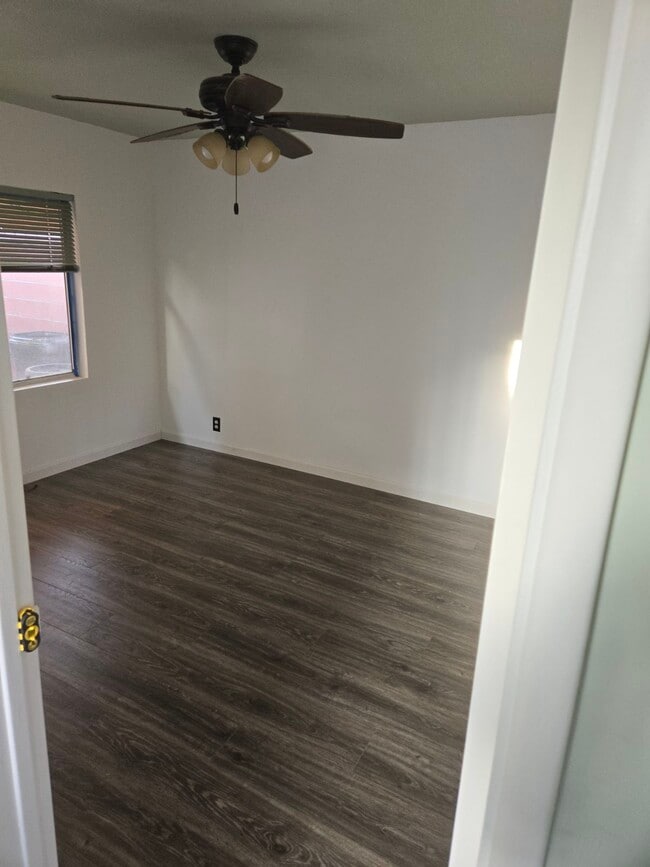 One living room Hardwood floors and ceiling fan