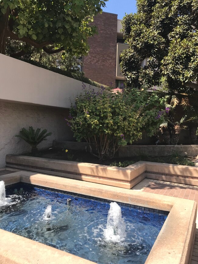 Lush landscaping throughout this four story garden style community - 850 State St Unit 324