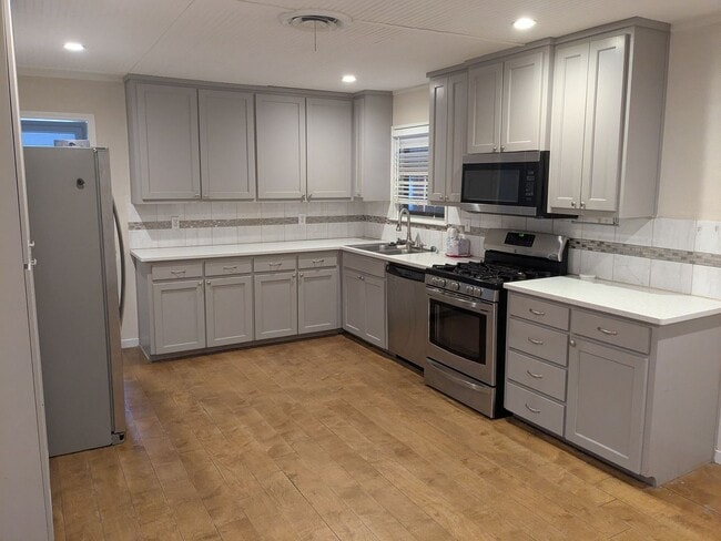 Photo - Spacious 4 Bed 2 Bath with Enclosed Patio and Stainless Steel Appliances