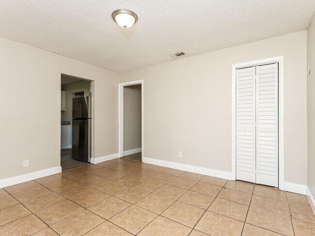 Photo - 3 BR/1BA | Newly Renovated Single Family Home | Screened in Patio and carpot | Huge backyard!