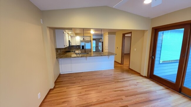 Photo - 4bd/3ba HUGE Home w/Hardwood Floors, Russian Fireplace, 2-Car Garage & Fenced Back Yard!