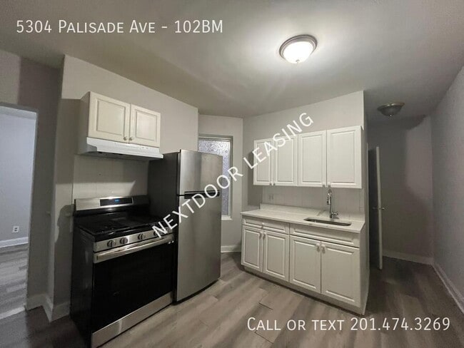 Building Photo - 5304 Palisade Ave Unit 102BM