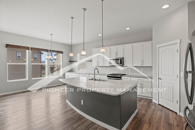 Photo - Elegant Ranch-Style Home with Main Floor Primary Bedroom with 3-Car Garage and Finished Basement ...