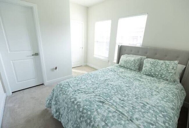 Photo - Available Now! Discover urban living at its finest in this 4-level gem!