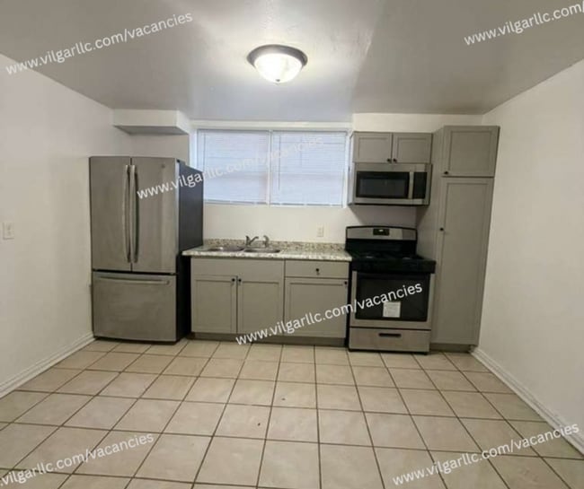 Building Photo - 700 E 20th Ave Unit Basement