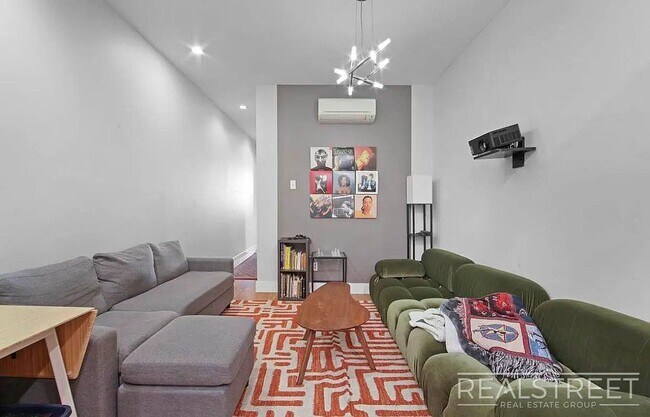 Photo - Spacious 3BR Apartment in Prime Bushwick | Skylight, Laundry, Courtyard | No Fee Unit 1L