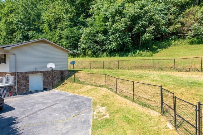 Photo - 3 br/ 2 bath home, private setting with garage/workshop
