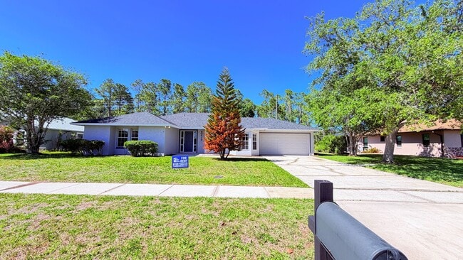 Photo - Bright & Spacious 3/2 Home with Huge Yard + Screened Patio — Lawn Care Included!
