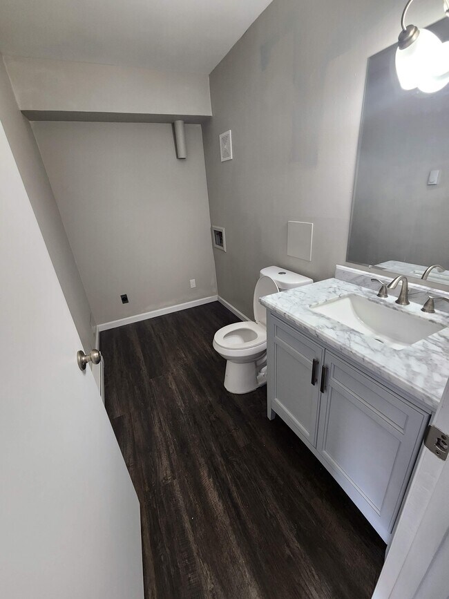 main floor laundry in half bath - 7572 Hazelcrest Dr Unit 7572