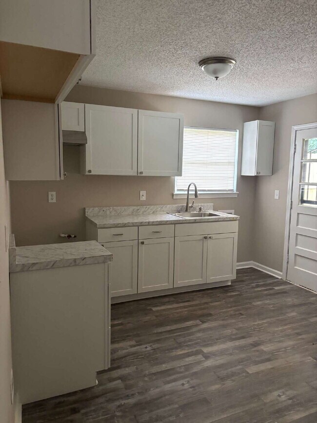 "Charming 3-Bedroom Retreat on Suncrest Drive with Gleaming Hardwood Floors!"