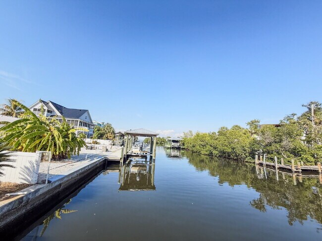 Photo - WATERFRONT POOL HOME ON A CANAL THAT LEADS STRAIGHT INTO TAMPA BAY - NEW DOCK AND SEAWALL COMING ...
