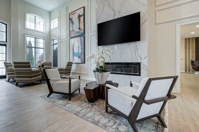 View-At-Legacy-Oaks-Apartment-Homes-in-Knightdale-NC-Renovated-Clubhouse-Lounge-Seating-Area-with-Fireplace