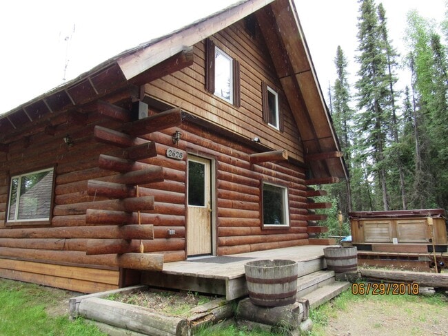 Photo - 3 Bed, 2 Bath, 2 Car Garage LOG HOME for RENT!