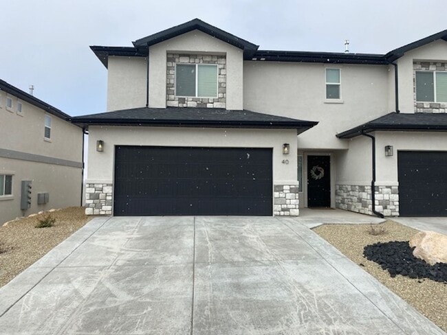 Building Photo - 3 Bed - 2.5 Bath, Large Townhouse - 2 Car Garage