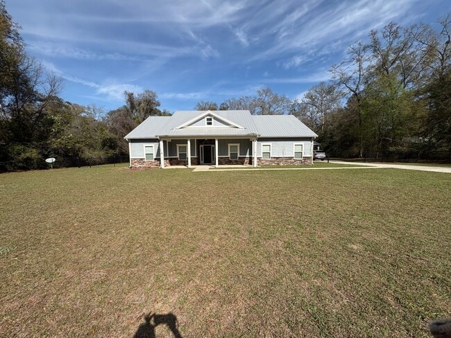 Building Photo - Available Now: Expansive 4BR Home with Rare 3-Bay Carport