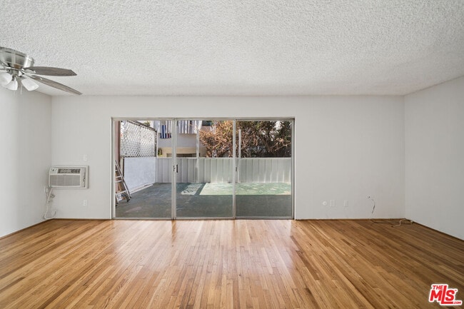 Building Photo - 7545 Hampton Ave Unit 108