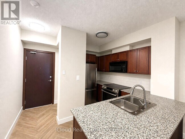 Photo - 1359 Rathburn Rd E Unité 408