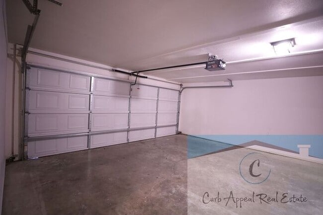 Photo - First month move in special $900!! Beautiful 3-bed, 2 bath condo with 2-car garage - includes was...