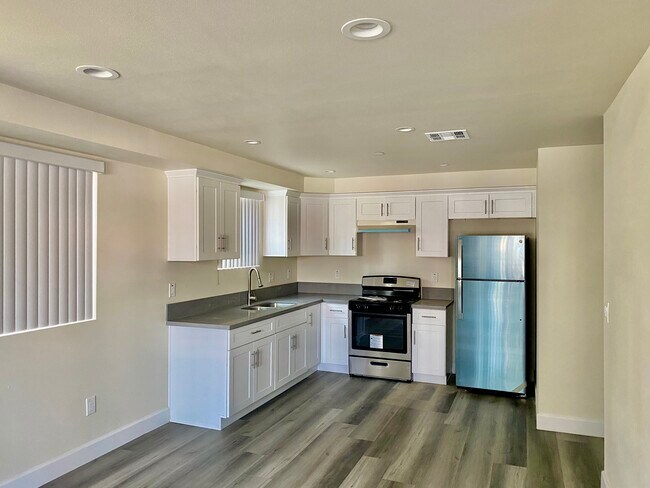Spacious, open style floor plan kitchen with new stainless steel appliances. - 3019 Raymond Ave