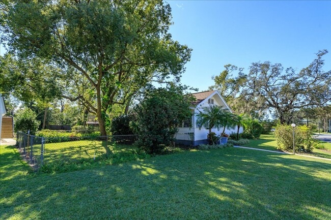 Photo - Run don't walk for this one of a kind beautifully maintained Old Florida Charmer on a park like d...