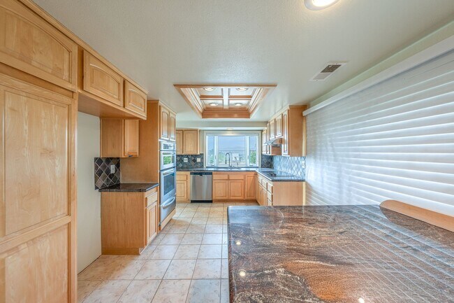 Photo - Single-story living with incredible panoramic sunset, mountain, and city light views