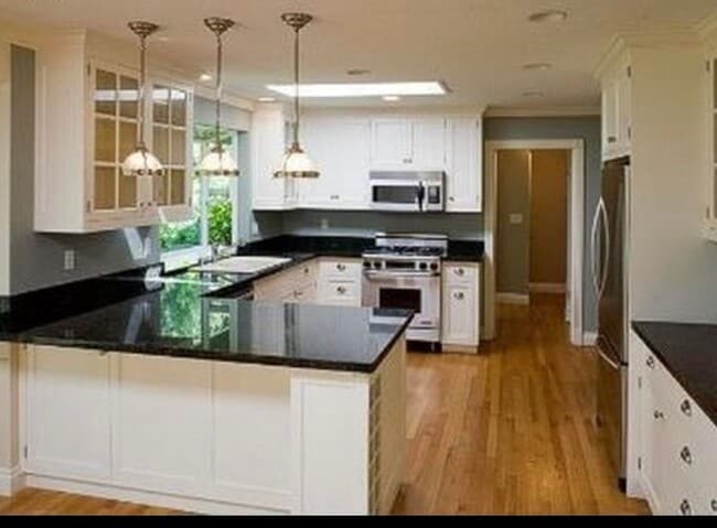 Photo - Spacious & light filled home with a garage, backyard, storage & hardwood floors throughout