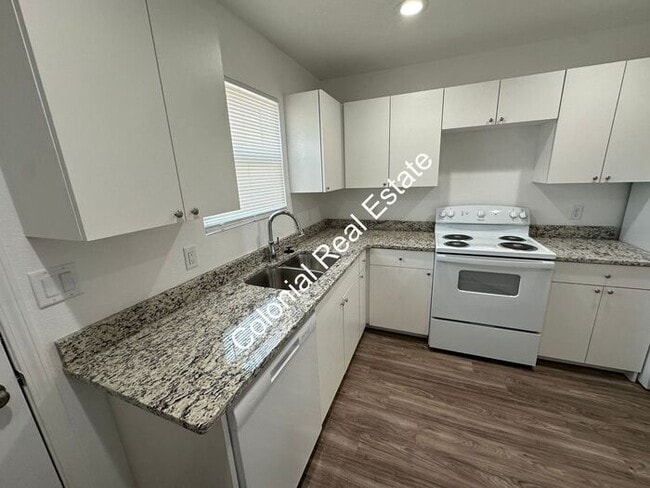Photo - Spacious and updated 2 bedroom 2 bathroom apartment for rent. Central heat and air, granite count... Unit a