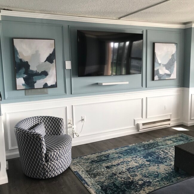 Open concept living area. Two TVs mounted and ready!