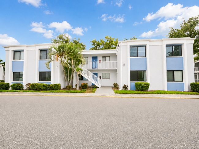 Building Photo - Updated 2-Bedroom Condo with Screened Lanai with water included.