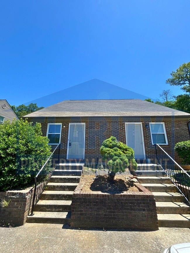 Building Photo - Two bedroom townhome w/ cathedral ceilings!