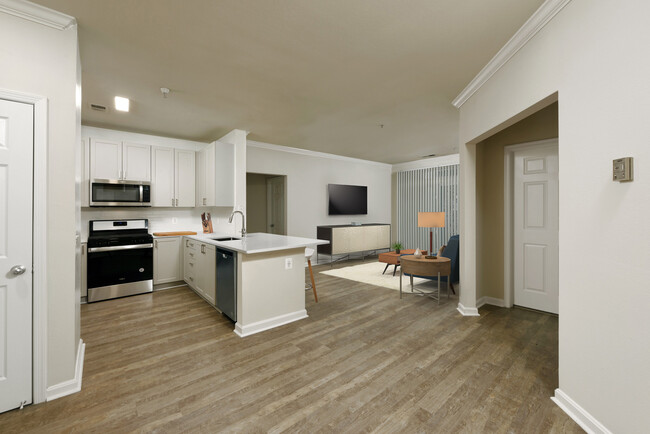 Renovated II kitchen and living areas with hard surface flooring - Avalon at Grosvenor Station Apartments