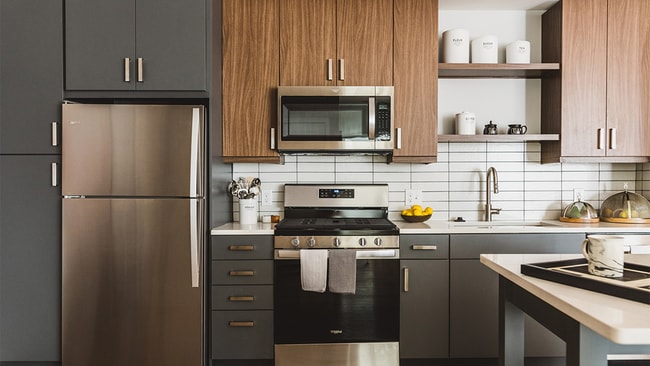 Kitchens with chef-islands, two-toned cabinetry with chrome pulls