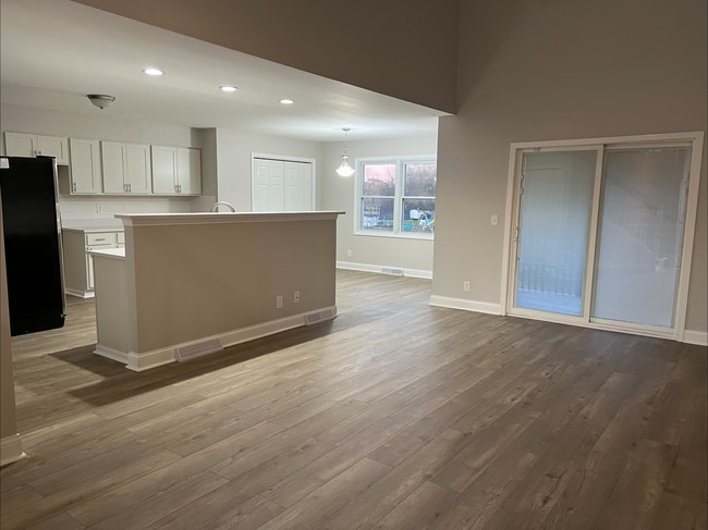 Living room, dining room and kitchen - 4601 52nd Ave Townhome