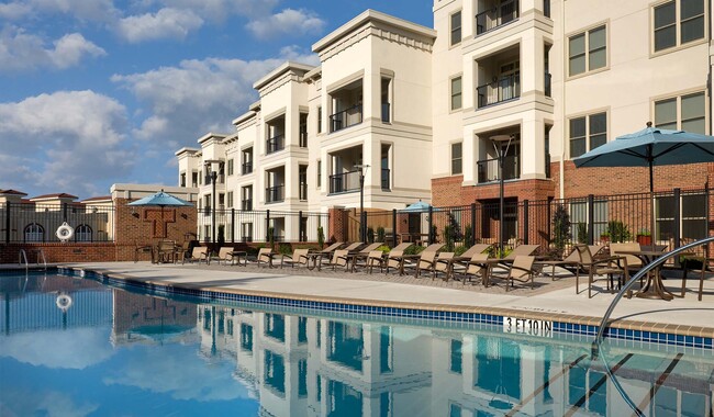 Lounge by the saltwater swimming pool with convenient outdoor pool shower - Tremont Apartments