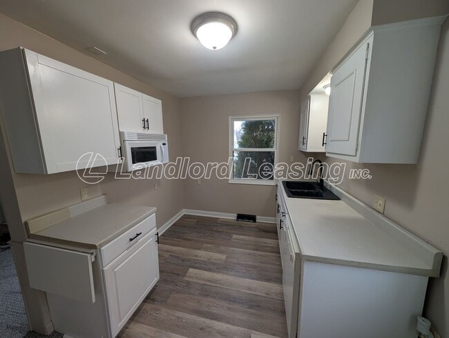 Photo - Updated Cape Cod with New Flooring, Front Deck & Garage