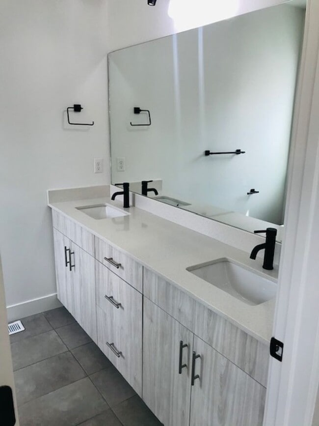 Photo - Beautiful new construction townhouse with quartz countertops and 2 car garage