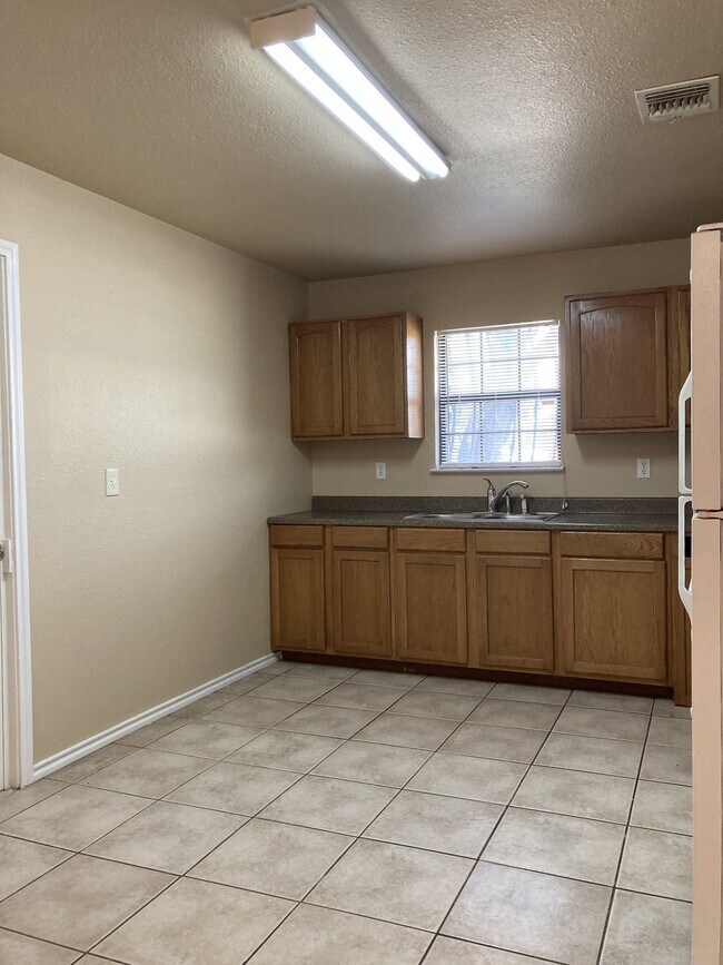 Updated 2 Bedroom Home with Bonus Room and Covered Patio