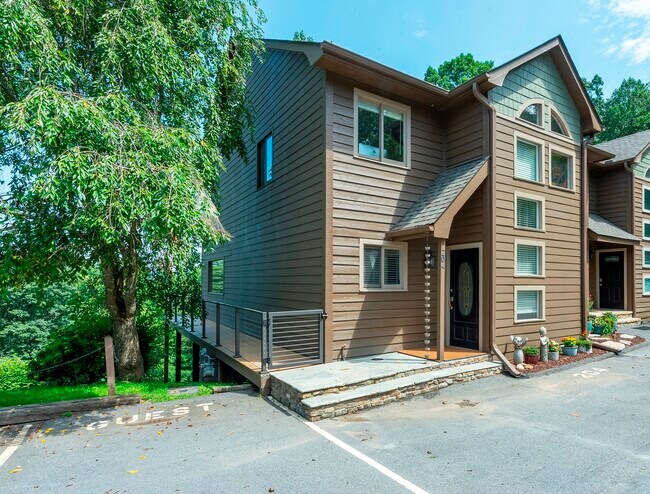 Charming mountain townhome exterior with private entrance and guest parking.