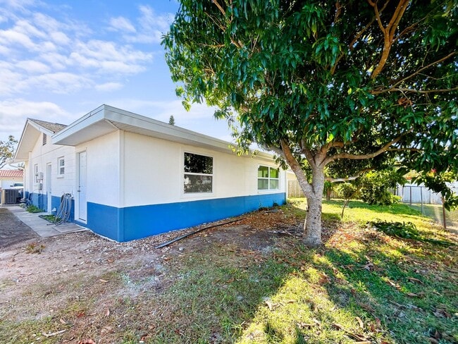 Photo - Beautifully Renovated 2BR/2BA with bonus room New Hurricane Windows + Backyard