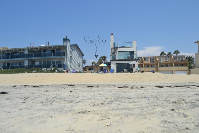 Condo building is steps to the sand