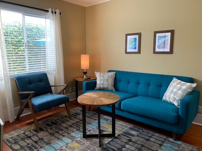 Fully furnished living room with high speed internet - 4685 Lotus St