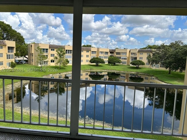 Building Photo - 6090 NW 64th Ave Unit 311