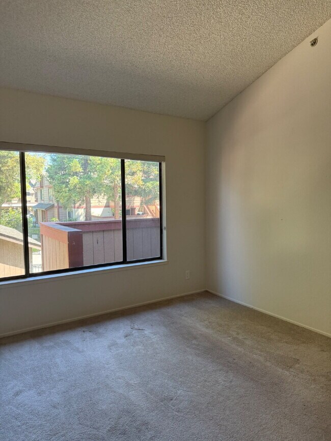 Photo - Spacious 3-Bedroom, 2-Bath Multi-Level Home with Balcony, In-Unit Laundry & Dual Parking