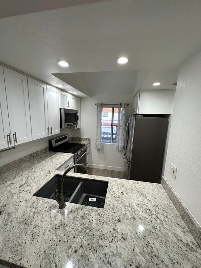 Photo - Charming Loft Condo with Balconies, Vaulted Ceilings & Fireplace – For Lease