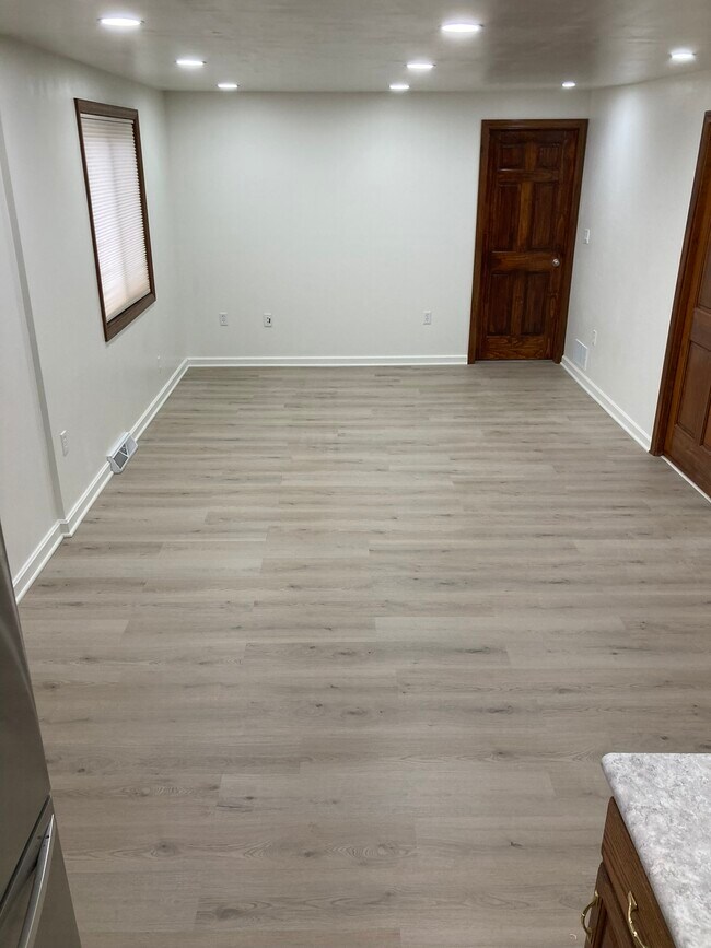 Livingroom with the kitchen to the rear - 1100 Center Ave Apartments Unit 1st floor rear