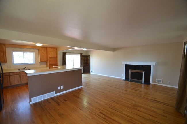 Photo - 4 bedroom home in Northglenn.  Newer paint with a large floor plan, wood floors & large deck for ...