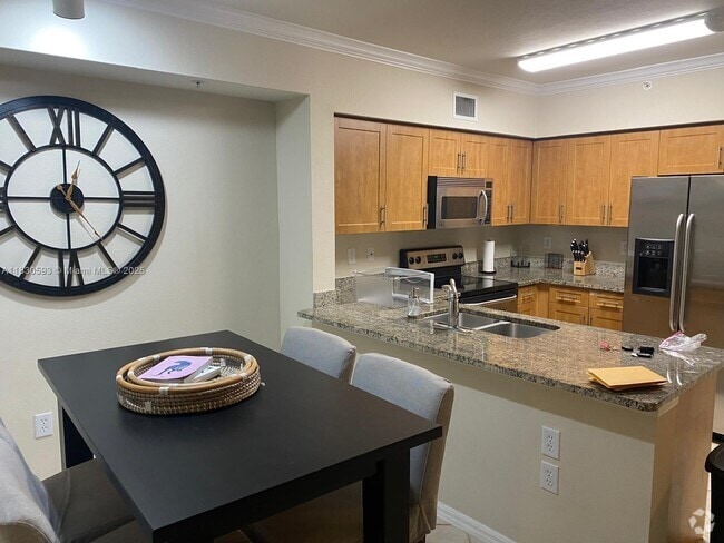 Building Photo - 6400 Emerald Dunes Dr Unit 303 Rental