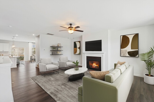 Upgrade Package Living room with hard-surface vinyl plank flooring throughout and fireplace
