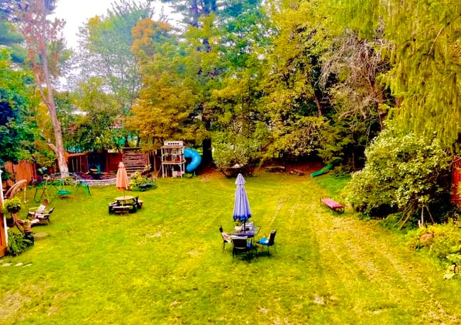 Looking out balcony to back yard - 198 S Main St Unit Blue Bird Apt B